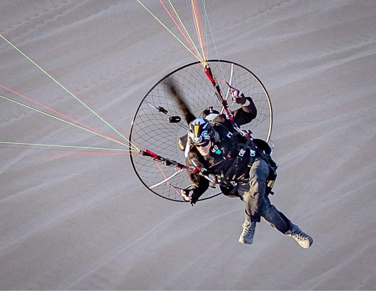 Paramotor pilot in flight